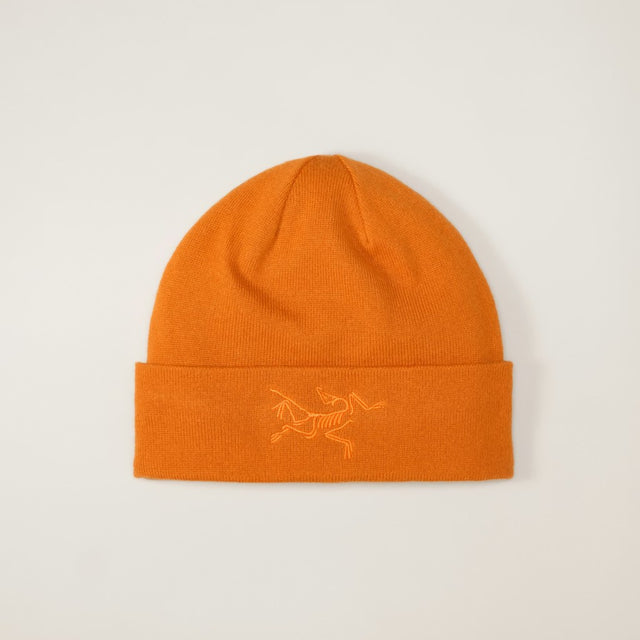 Arcteryx fleece lined toque with embroidered bird logo in copper sky/black colour