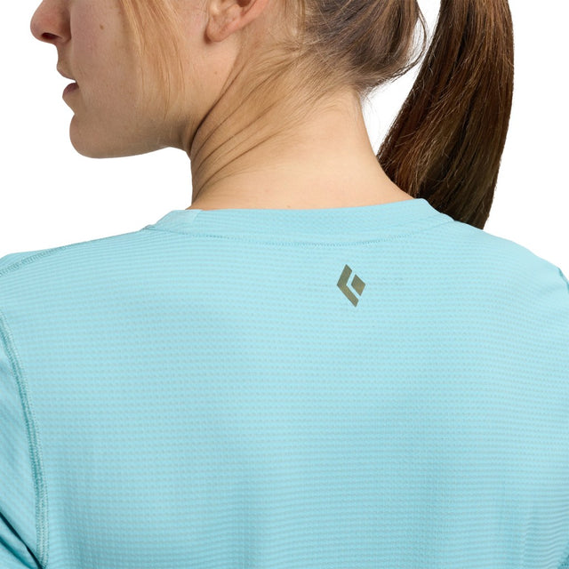 Back on-model view of women's Black Diamond Distance SS Tech Tee in glacier colour