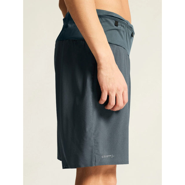 Craft Pro Trail Shorts Men's model side view in Norit colour