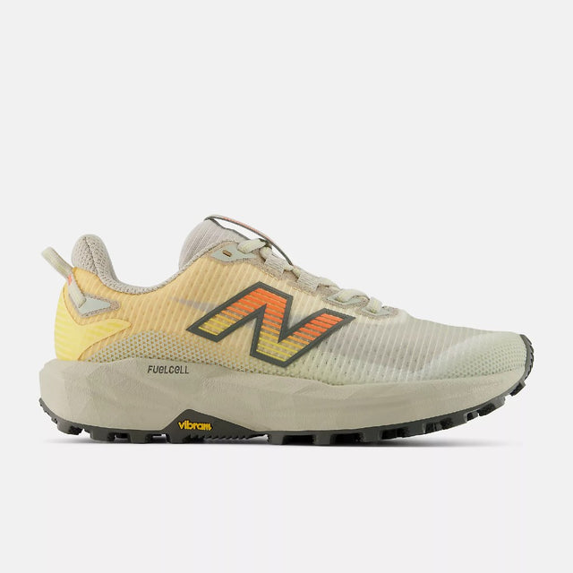 Side view of women's white peach New Balance FuelCell Rebel Trail running shoe