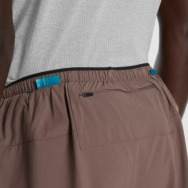 Back pocket detail view of New Balance RC Essential Shorts 5" Men's in Cortado with slate grey colour