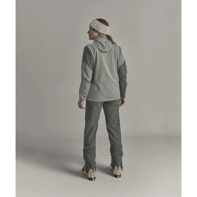 Back on-model view of Ortovox Ortler Softshell pants women's in dark sage colour