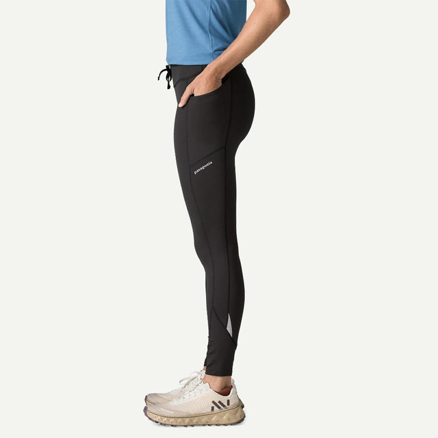 Side on-model view of Patagonia Peak Mission Tights Women's in black colour