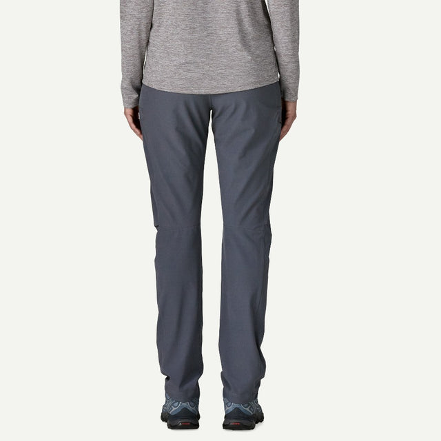 Back on-model view of Patagonia Terravia Trail Pants women's in smolder blue colour