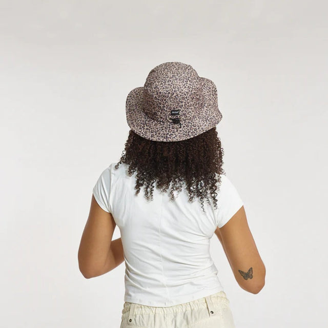 Back view of model in Skida Sun Hat in Wild Thing colour