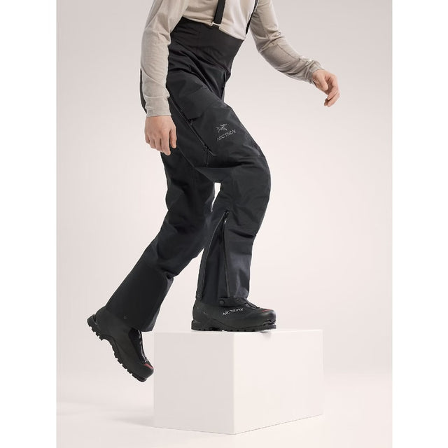 Side view of men's black Arc'teryx Alpha SV Bib