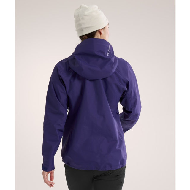 Back on-model view of women's Arc'teryx Beta SL gore-tex jacket in Soulsonic colour