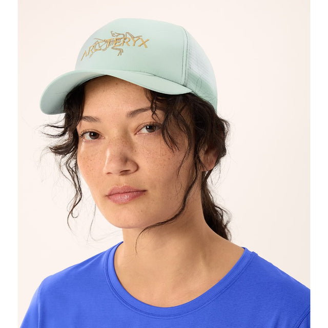 On-model view of Arc'teryx Bird Word trucker hat in trail magic colour