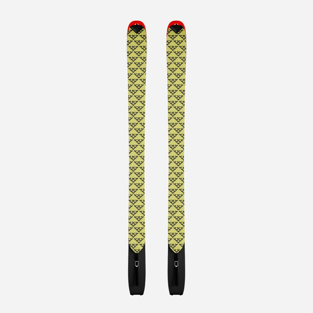 Pair of yellow/black Black Crows touring skins on a pair of Camox skis