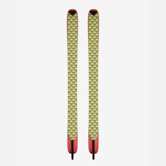 Pair of black/yellow Black Crows touring skins on skis