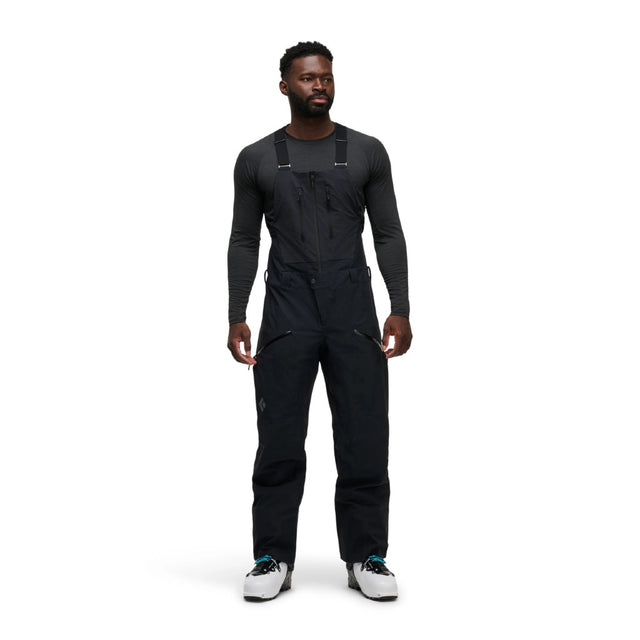 Front on-model view of men's black Black Diamond Recon Stretch bibs