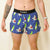 Front on-model view of men's Chicknlegs 4" half split running shorts in blue/sharks print