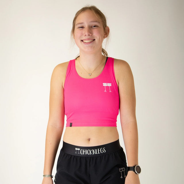 Front view of women's ChicknLegs PWR crop top in neon pink