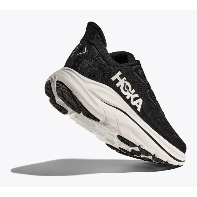 Sole view of women's Hoka Clifton 10 running shoe in black/white