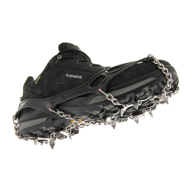 Bottom view of a black hiking boot with kahtoola MICROspikes on