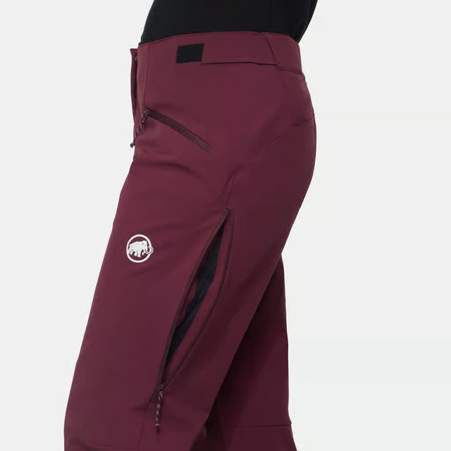 Side venting zipper detail of women's maroon Mammut Taiss Guide SO pants