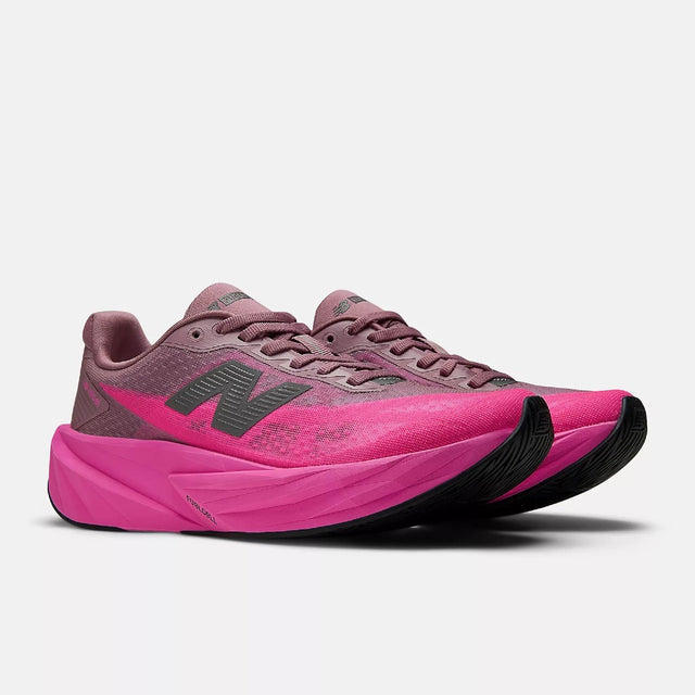 Pair of women's pink New Balance FuelCell Rebel v5 running shoes