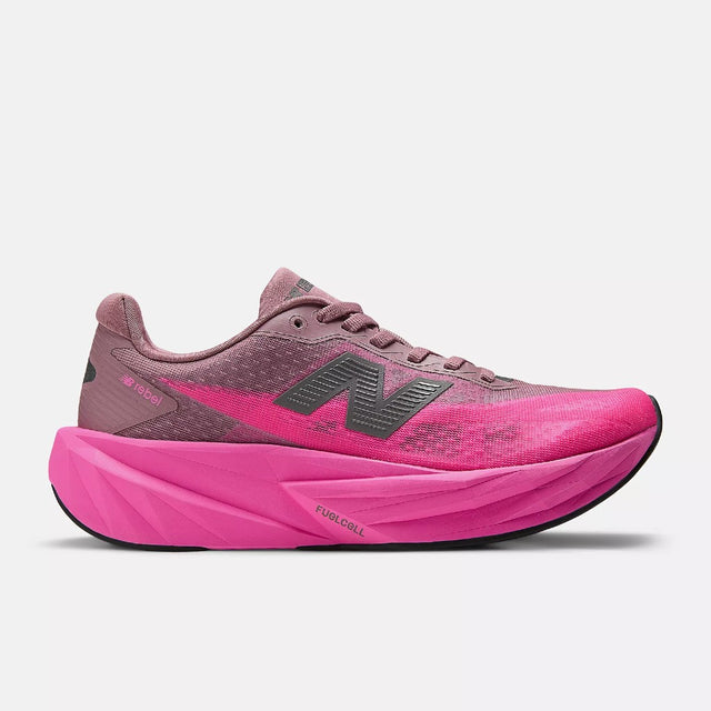 Side view of women's pink New Balance FuelCell Rebel v5 running shoe