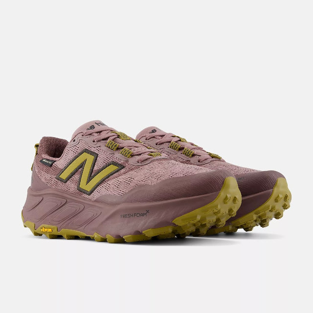 Pair of women's pink/gold New Balance Hierro v9 Gore-Tex trail running shoes