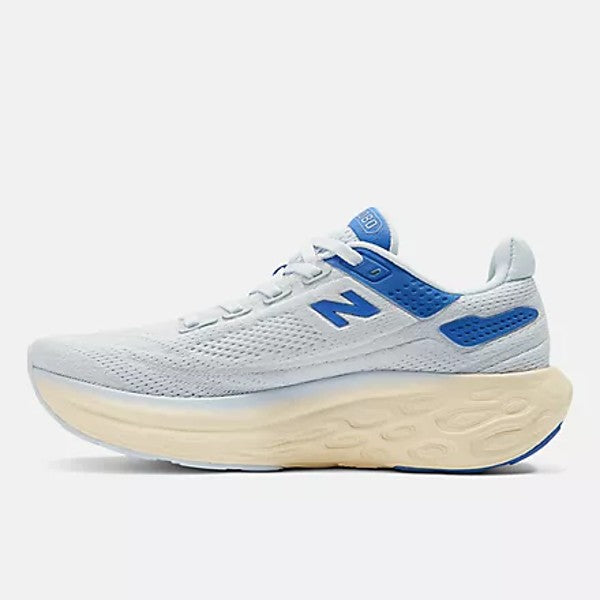 Inner side view of women's New Balance Fresh Foam X 1080v13 running shoe in starlight with marine blue