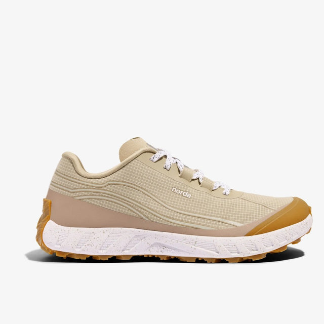 Side view of norda 002 running shoes in Sand colour