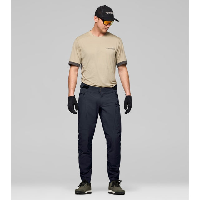 On-model view of men's Caviar Black Norrona fjora flex1 mountain bike pants