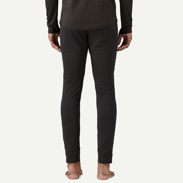 Back on-model view of men's Patagonia Capilene thermal bottoms in black