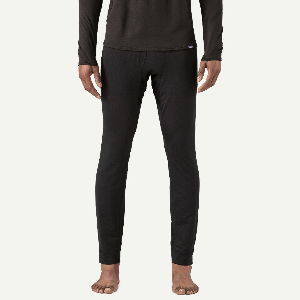 Front on-model view of men's Patagonia Capilene thermal bottoms in black