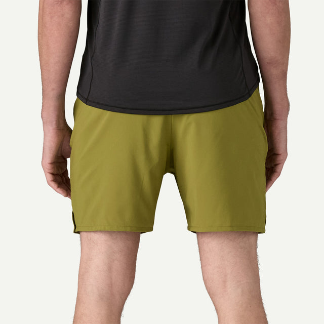 Back on-model view of men's green patagonia multi trails shorts