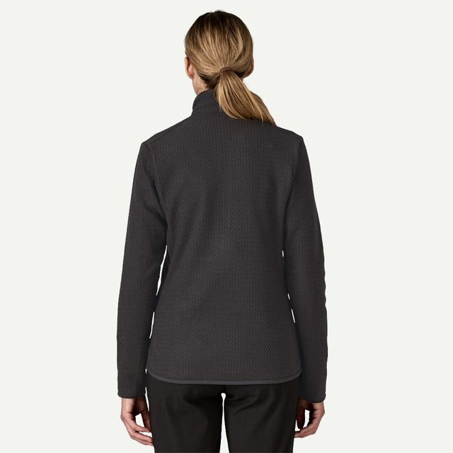 Back on-model view of women's black Patagonia R1 Air fleece jacket