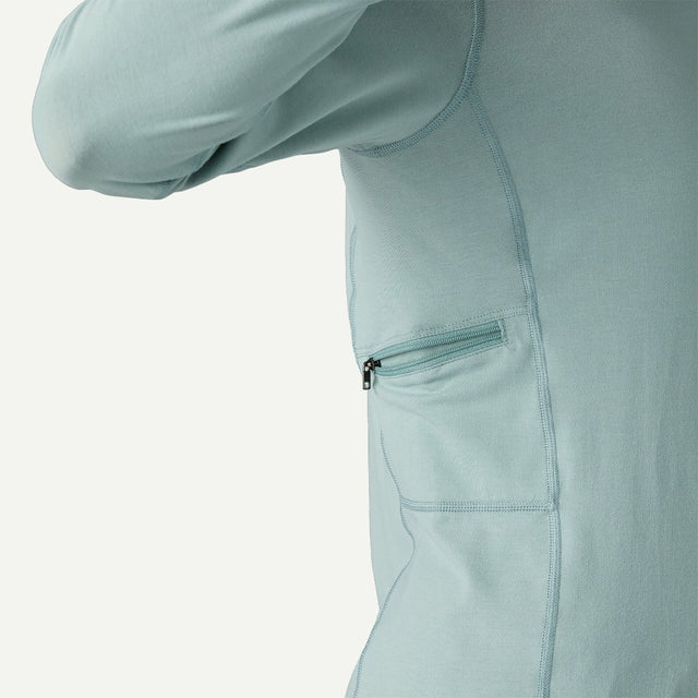 Side zip pocket detail of women's patagonia Tropic Comfort Sun Hoody in thermal blue colour