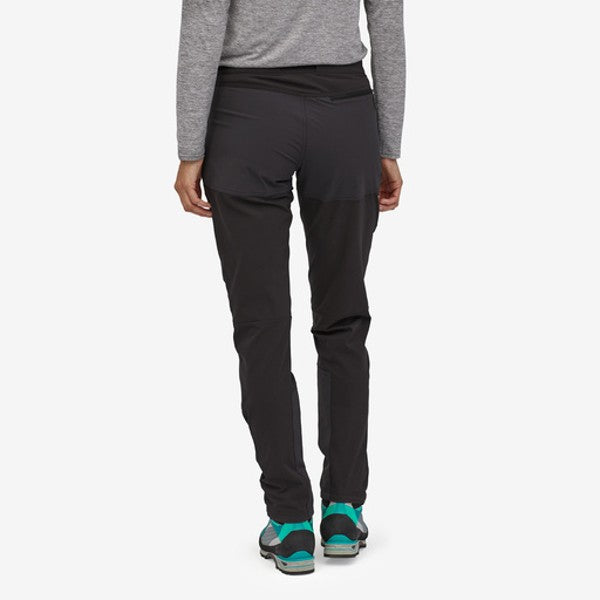 Back of model wearing patagonia women's terravia alpine pants in black