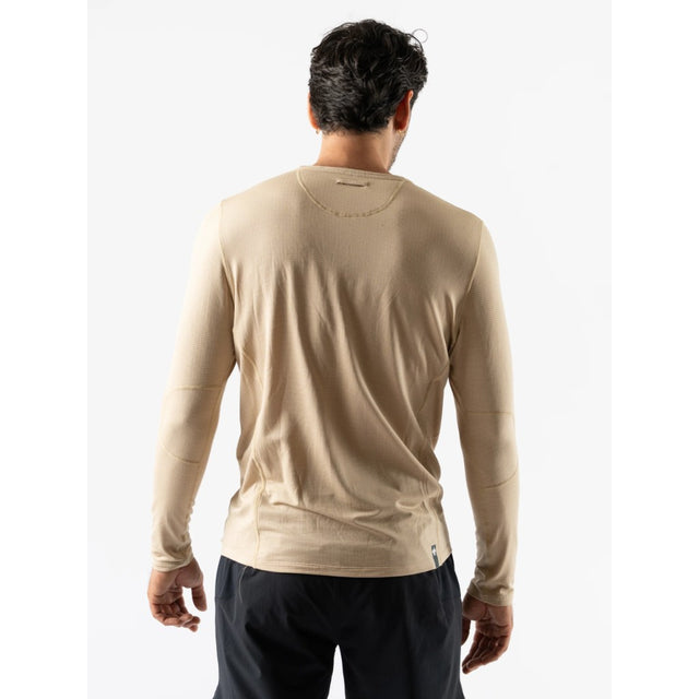 Back on-model view of men's cream coloured Rabbit Layer One base layer long sleeve