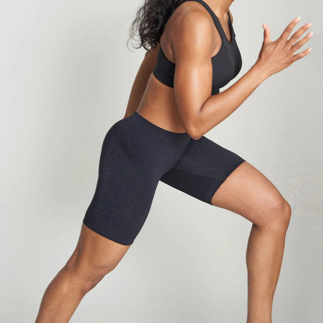Side on-model view of women's black runderwear long boxers
