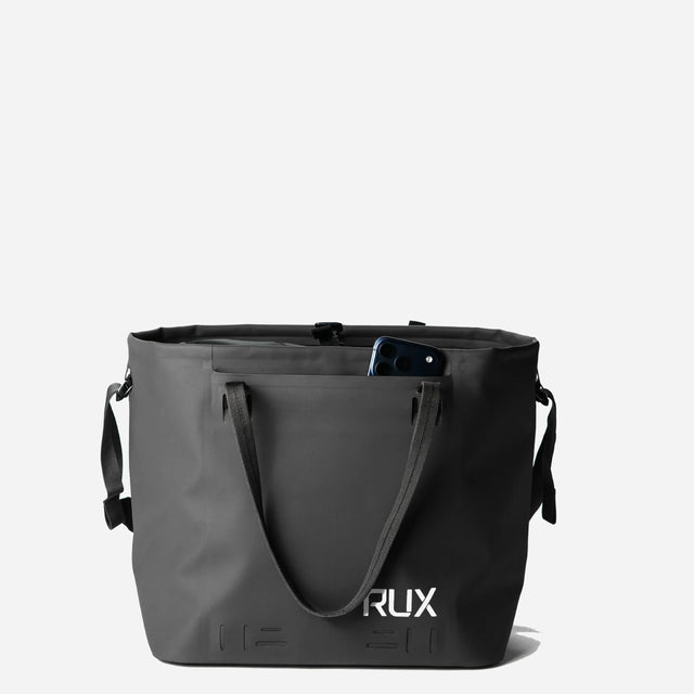 Black RUX waterproof 30L tote bag, phone in side pocket