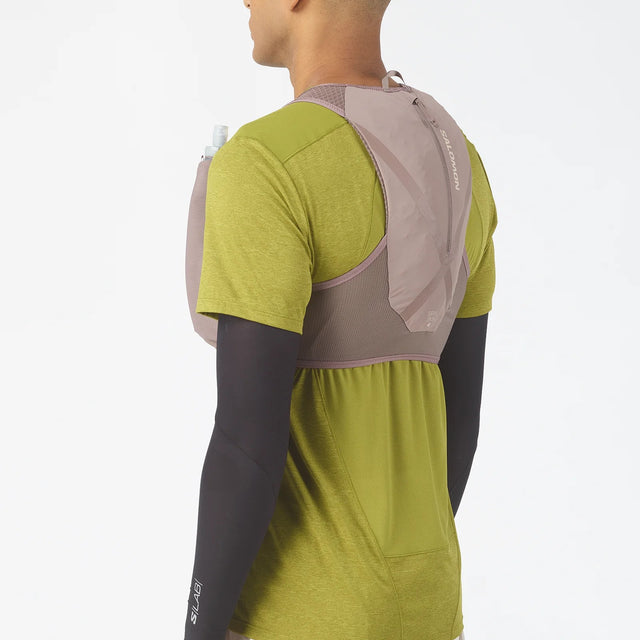 Back on-model view of grey Salomon Gravel Skin 4 running vest
