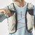 Front on-model view of Salomon S/Lab Ultra 10 running vest in almond milk colour