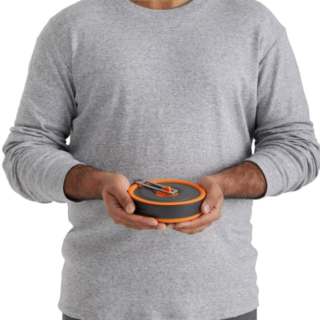 Model holding the Sea to Summit frontier ultralight collapsible pot