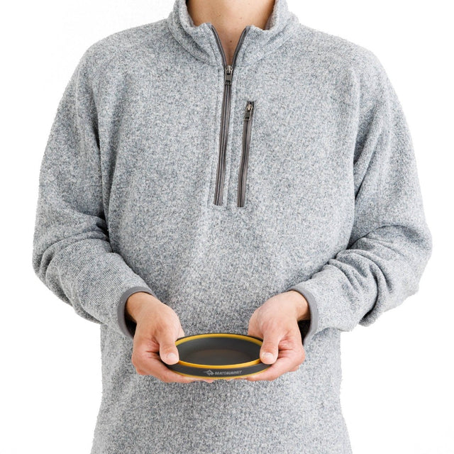 Model holding Sea to Summit Frontier Ultralight collapsible bowl