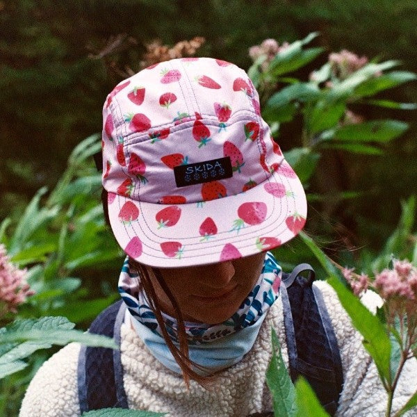 On-model top view of skida brim hat in strawberry fields print