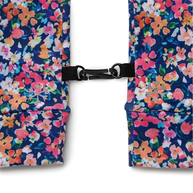 Clip between pair of floral-patterned Skida gloves