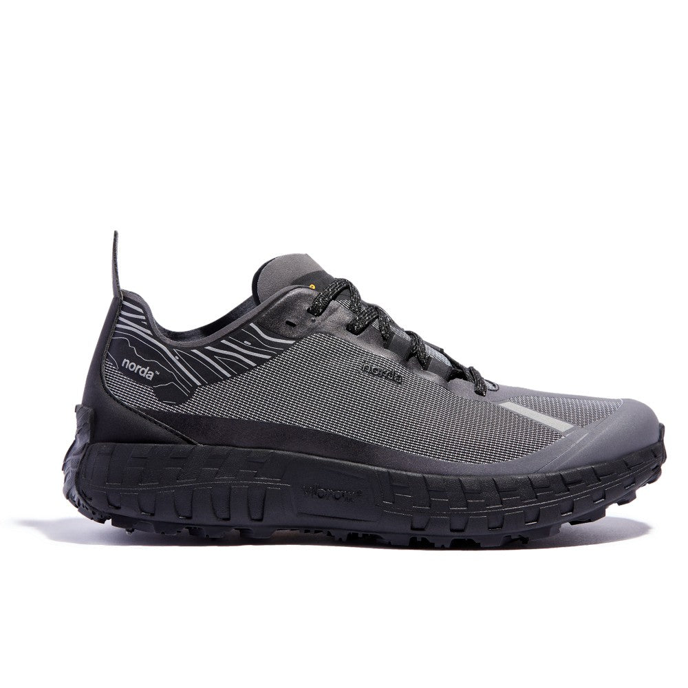 Side view of men's norda 001 G+ Spike winter trail running shoe in black