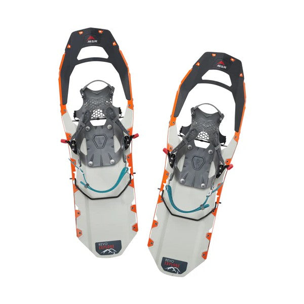 Top view of a pair of orange/white MSR Revo Explore snowshoes