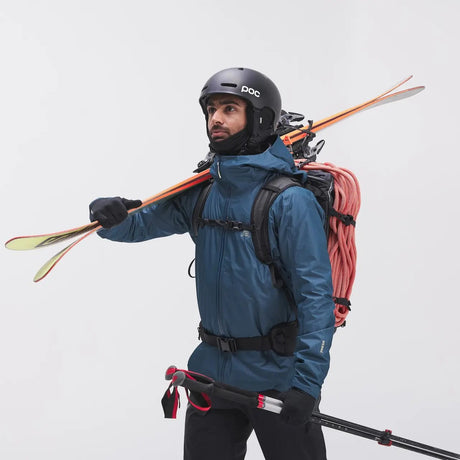 Skier wearing men's blue 7mesh Guardian Air jacket