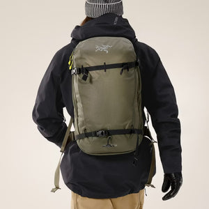 Front view with model of Arcteryx Quintic 28 liter backpack in Tatsu colour