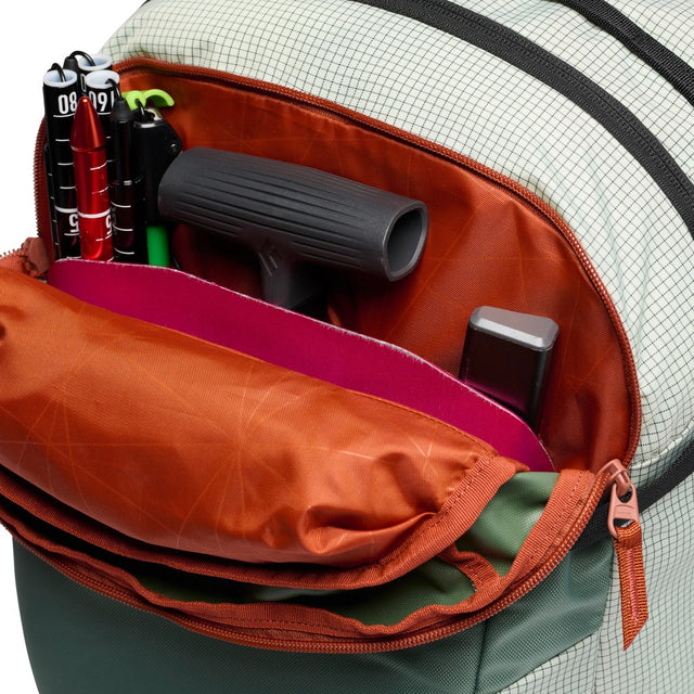 Shovel pocket view of Black Diamond Dawn patrol 32 backpack in Foam Green colour