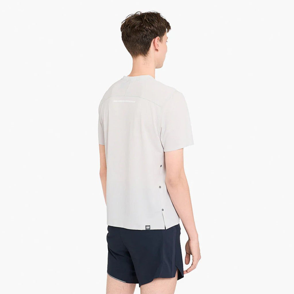 Back view of model with the ciele FST Tshirt 2 in light grey colour