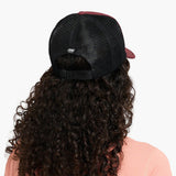 Back view of model with Ciele TRLCap SC Field Iconic Bar in andorra colour