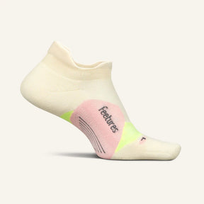 Side view of Feetures Elite LC no show tab sock in sandy melon colour