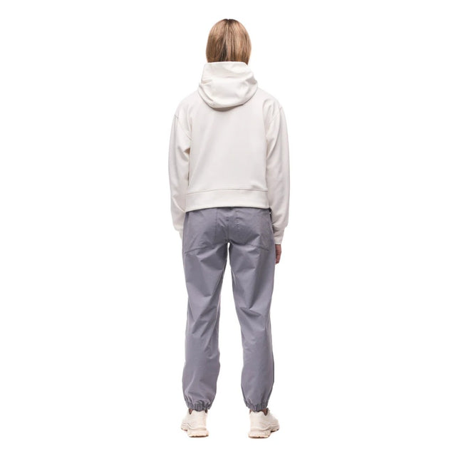 Back view on-model of Indyeva Andolana LT pants in dark boreal colour